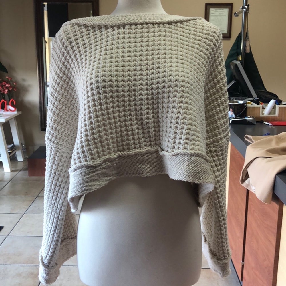A beautiful cream colored Free People sweater.